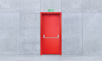 How should an emergency exit door be?